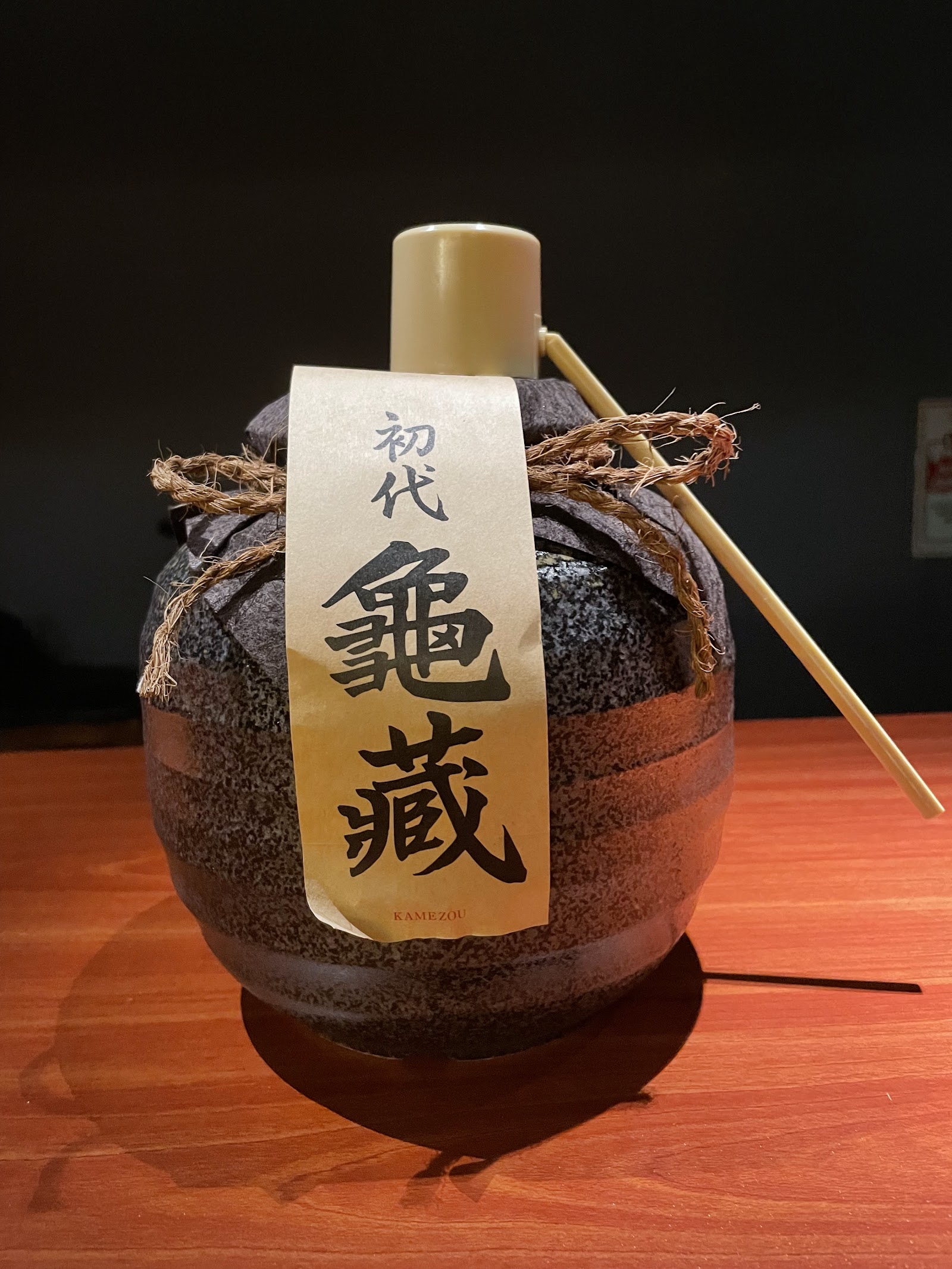 The ceramic jar of house shochu at Bar Mitsuboshi