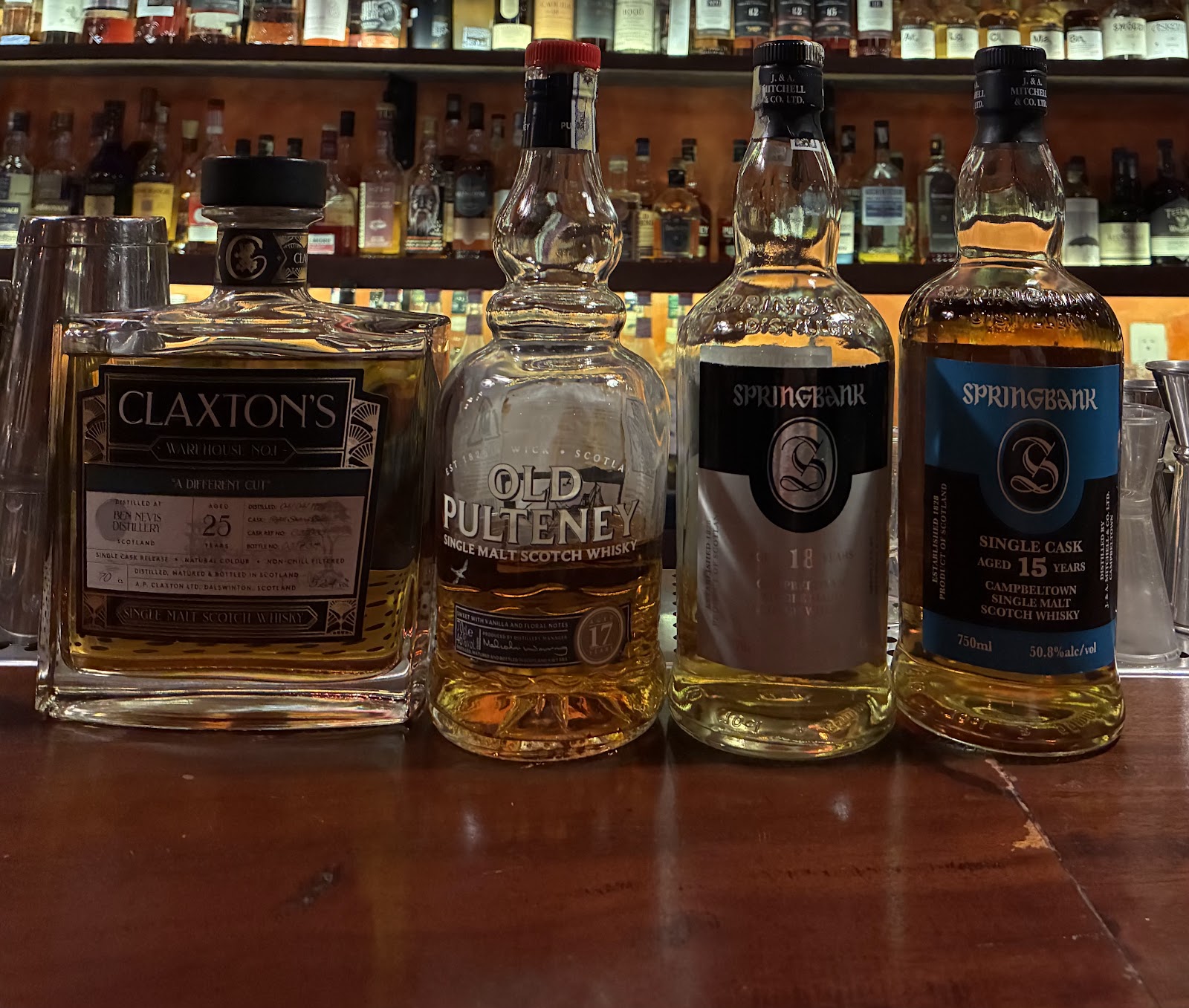 The collection wall — 250+ whisky bottles