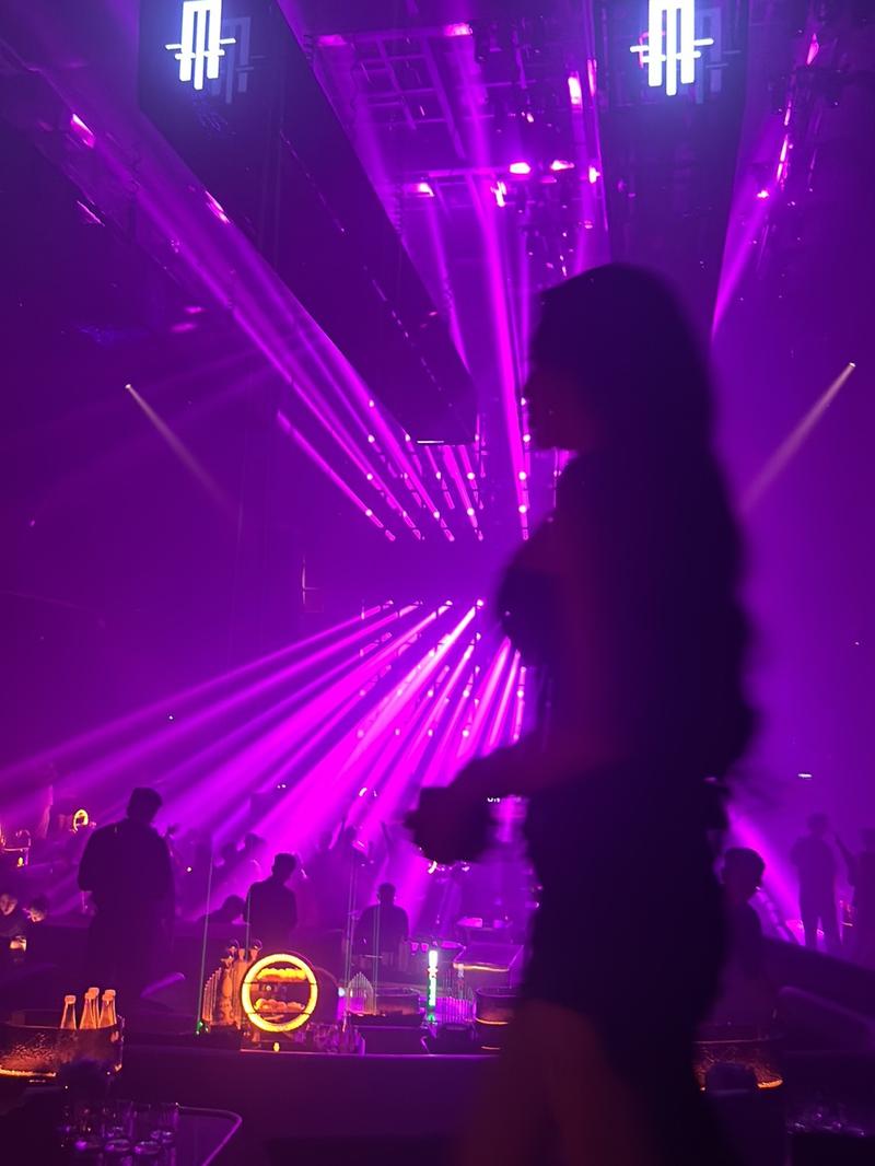 A silhouette against the lasers at APLUS Saigon