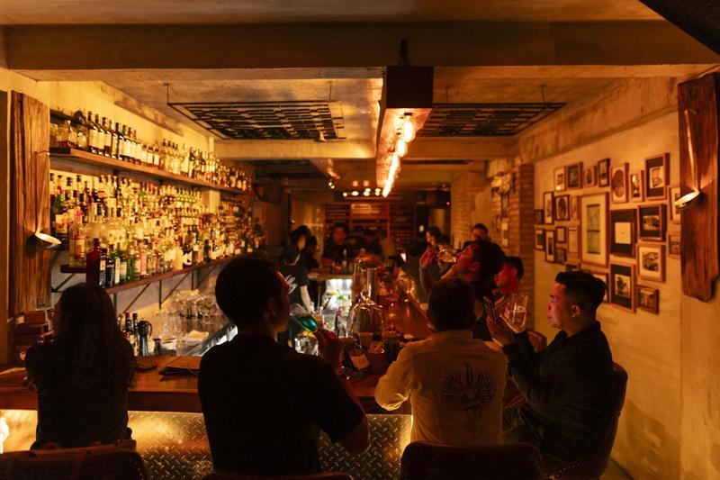 The Alley interior — brick, timber and low light