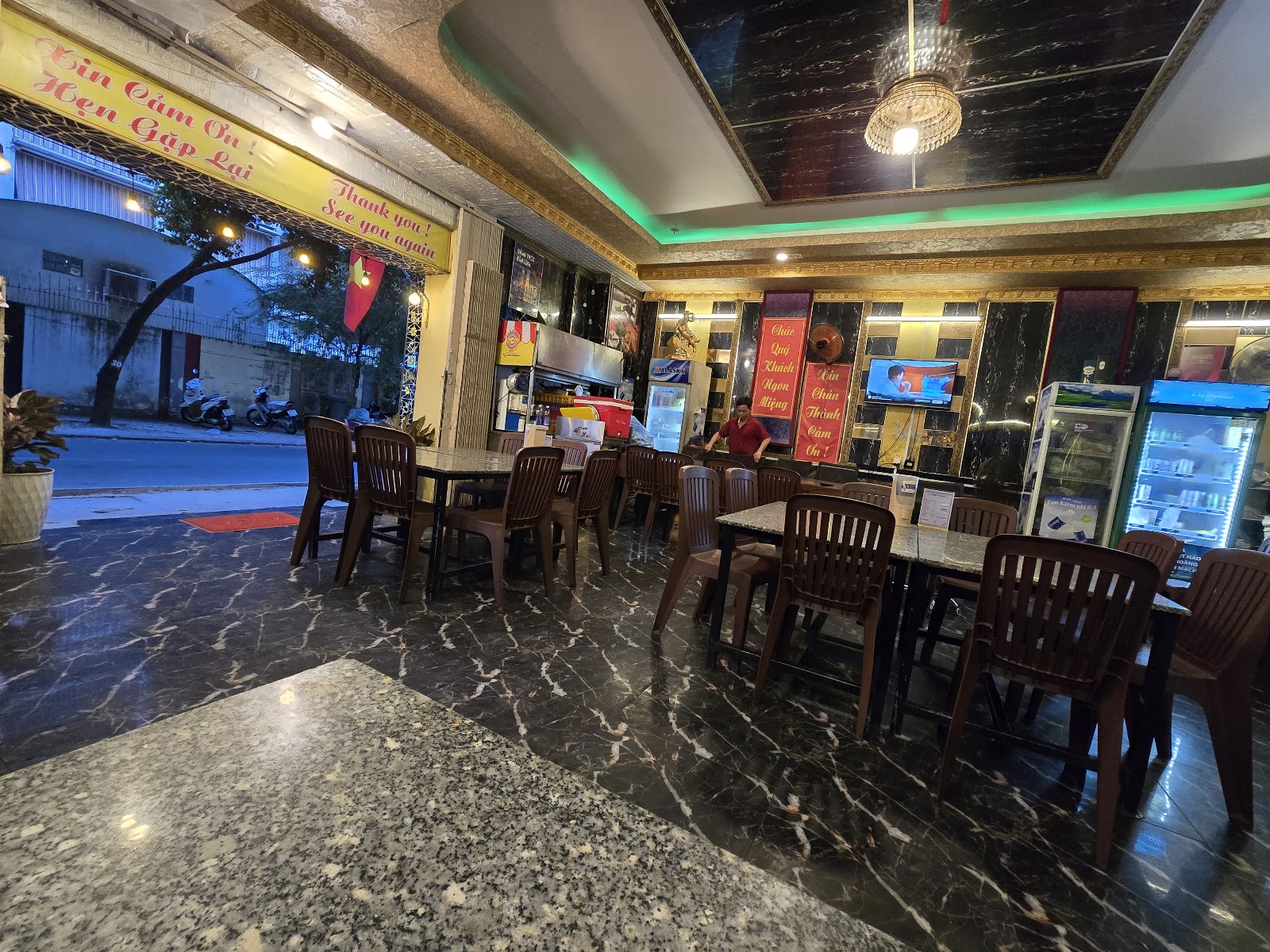 Ground-floor dining area, marble floor, open to the street
