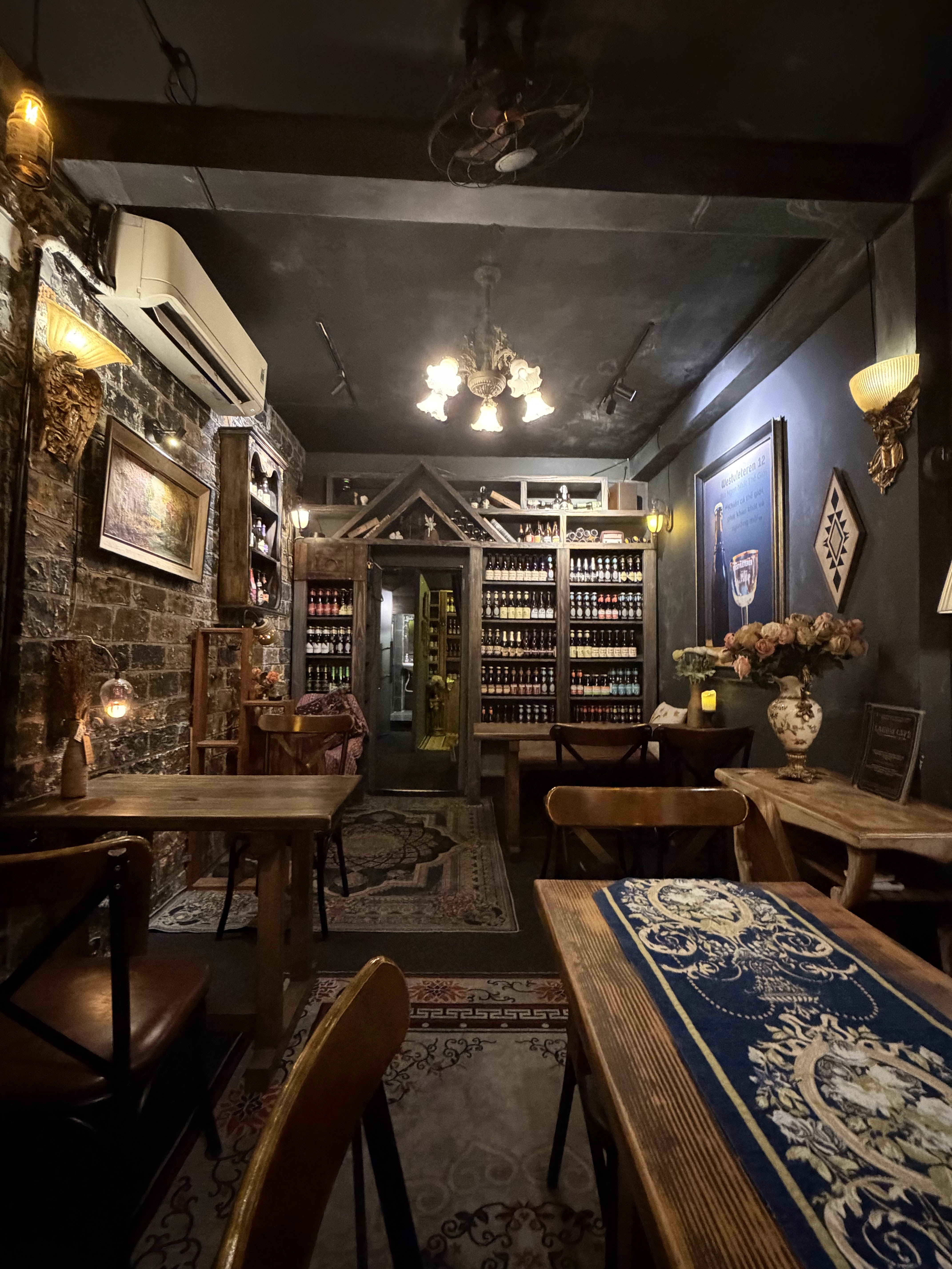 Stone-wall room, chandelier, beer shelf at back