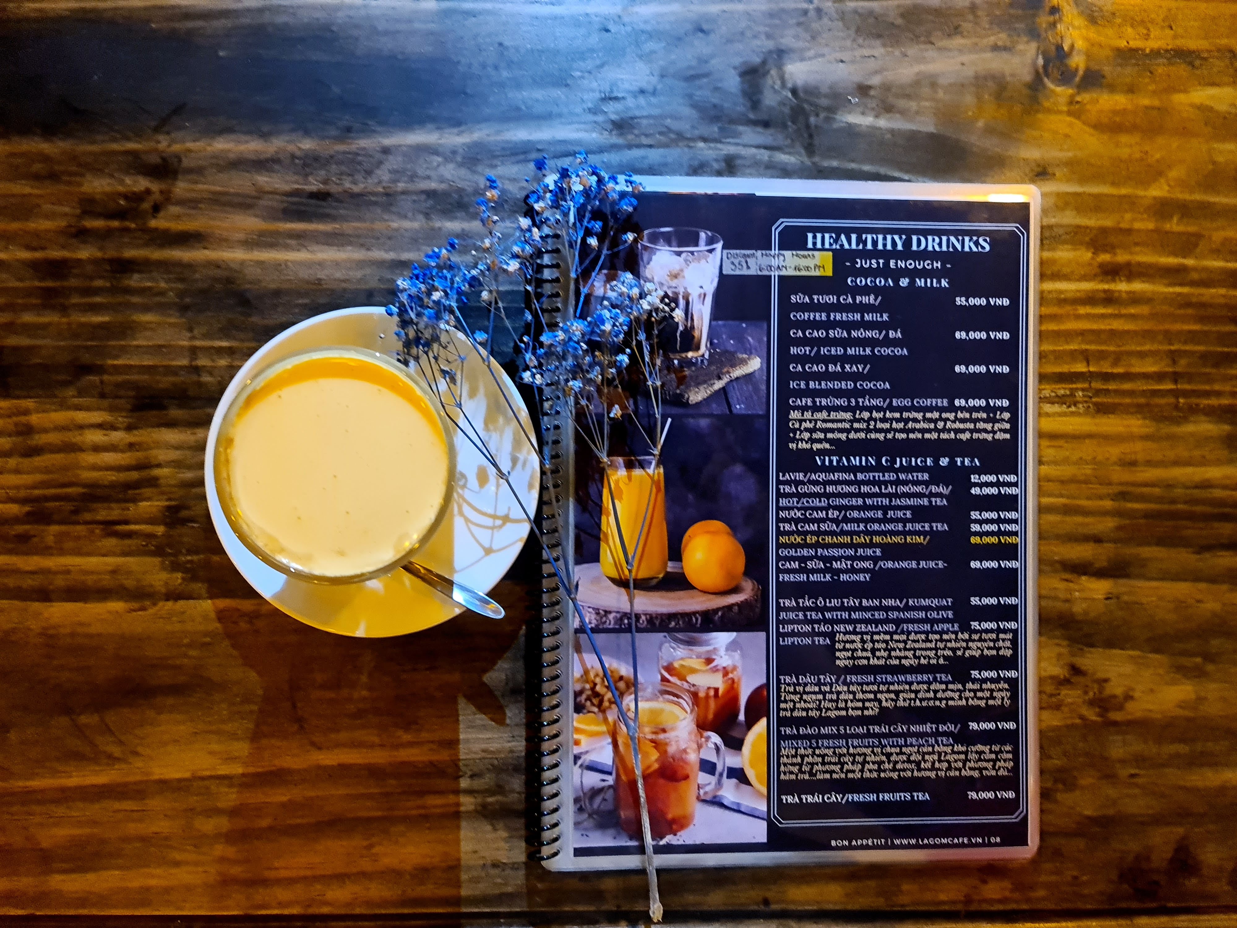 Latte art beside the printed beer menu