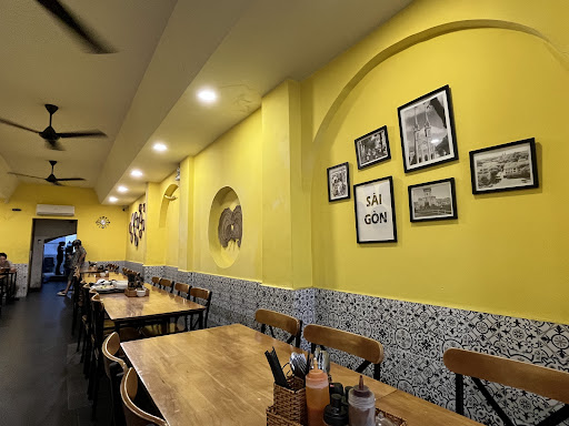 Sun-yellow dining room, black-and-white tile