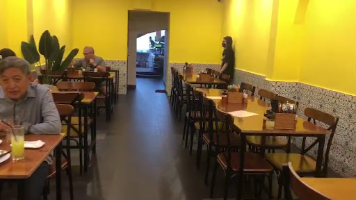 Yellow dining room with diners