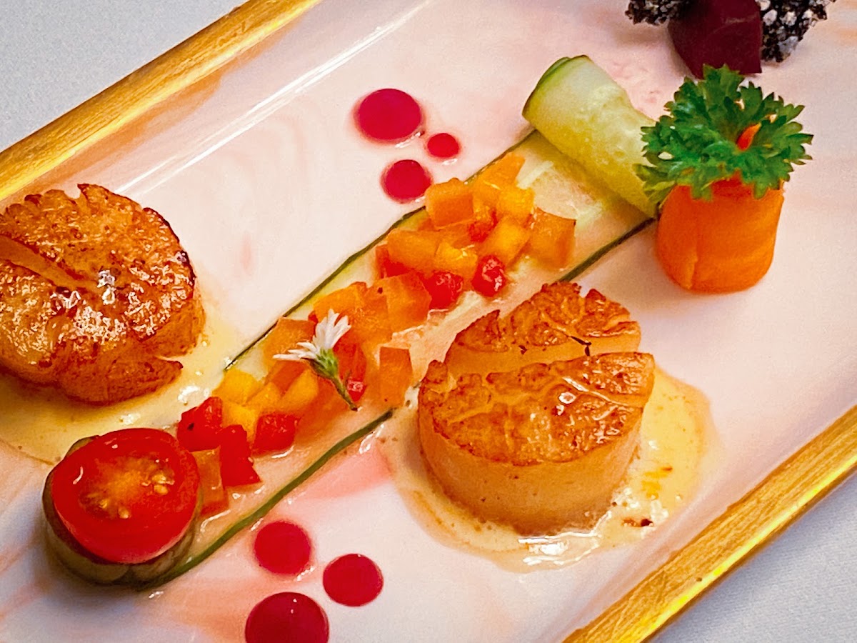 Fine plating close-up — pan-seared scallops