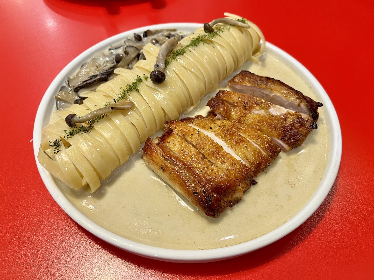 Grilled chicken with mushroom pasta — twirled fettuccine, creamy mushroom sauce